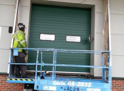 green industrial door with windows