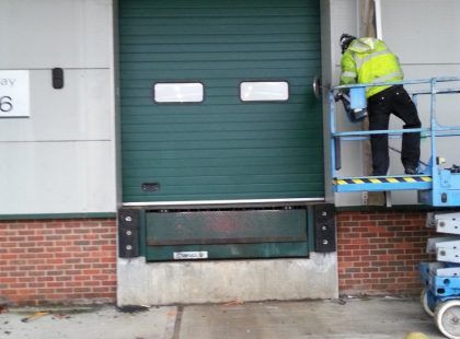 green industrial door with windows