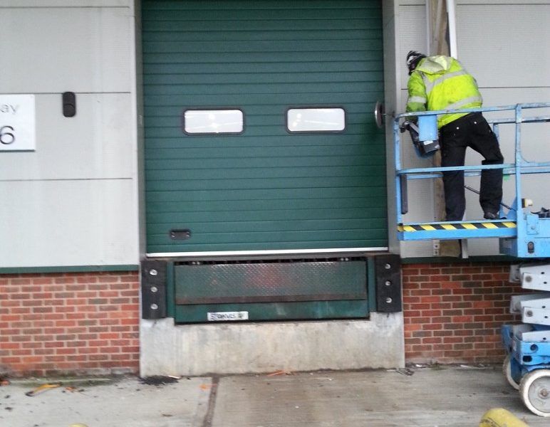 green industrial door with windows