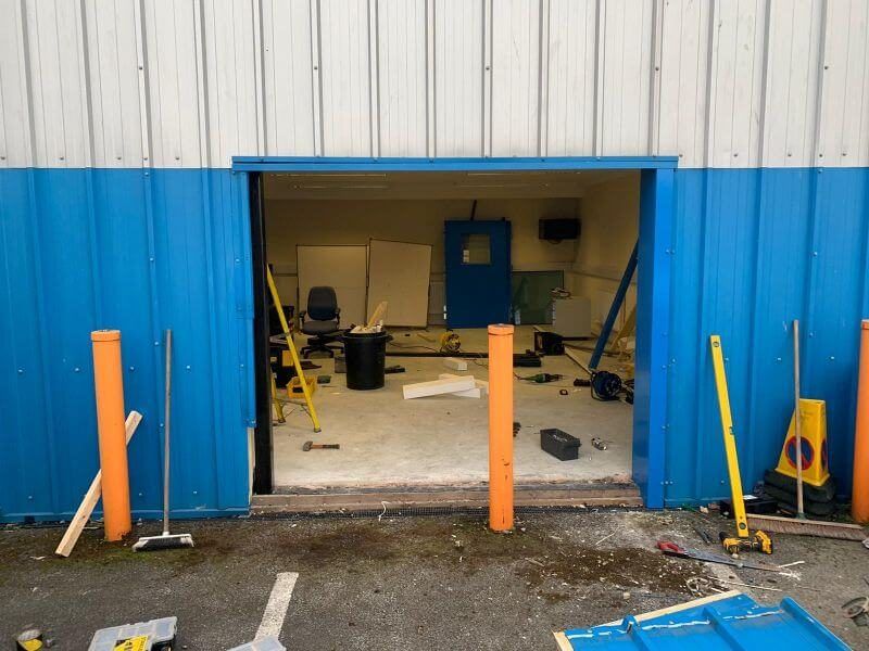 Our team repairing a set of industrial doors.